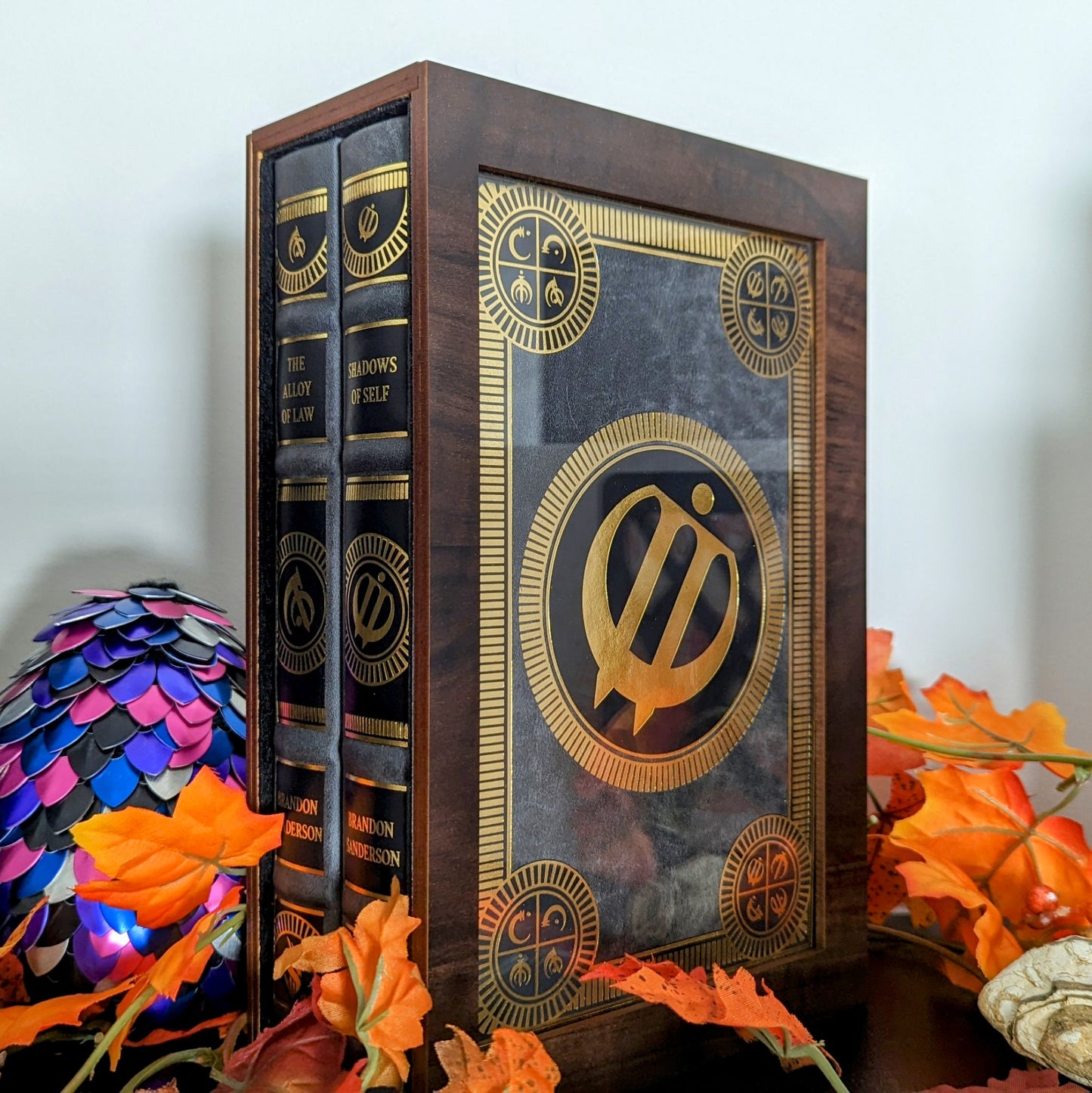 Custom size book display case by Dragon Woodshop showcasising Mistborn Alloy of Law and Shadows of Self Leatherbound by Brandon Sanderson