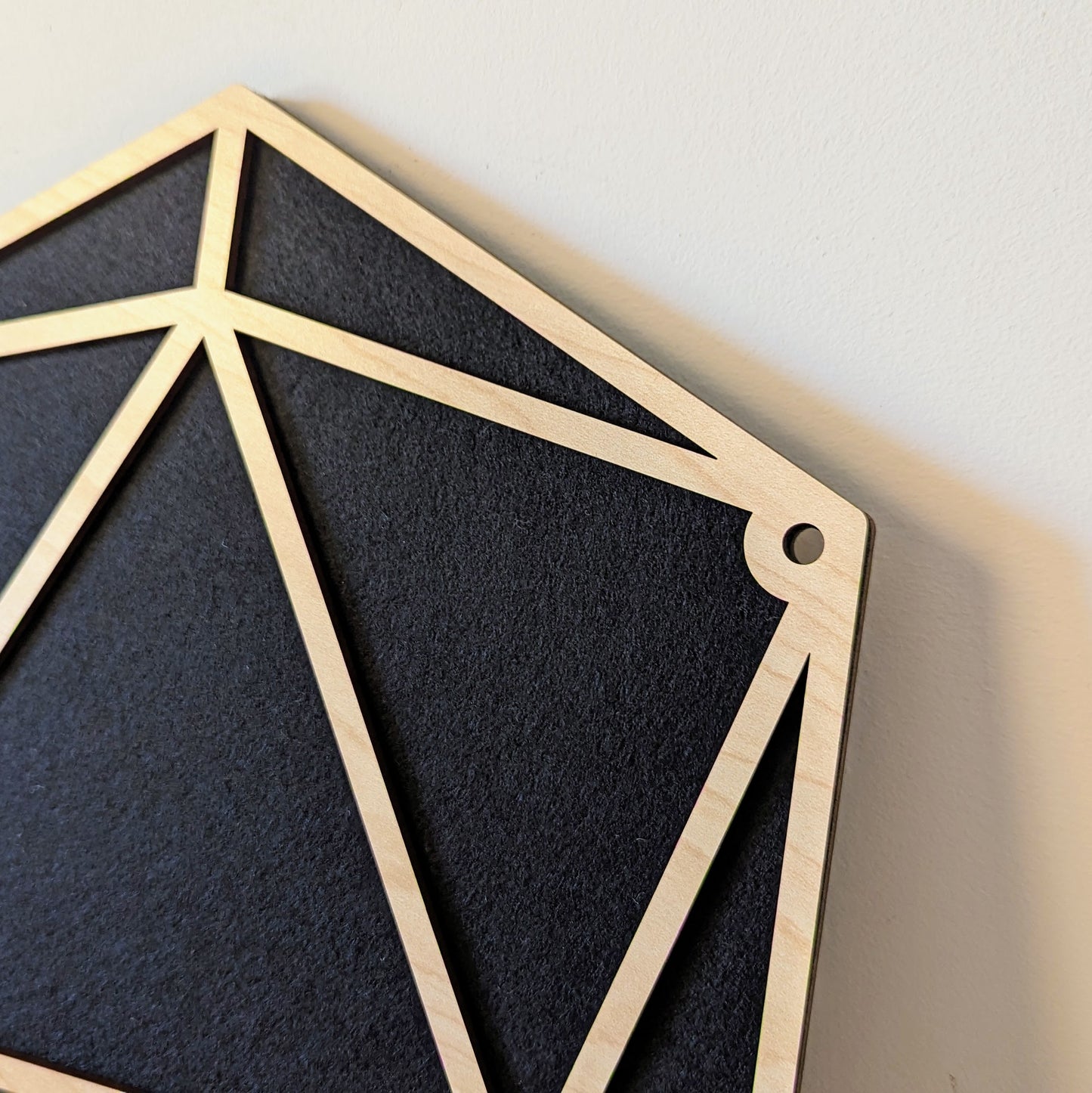simple pin display in the shape of a D20 die facets
