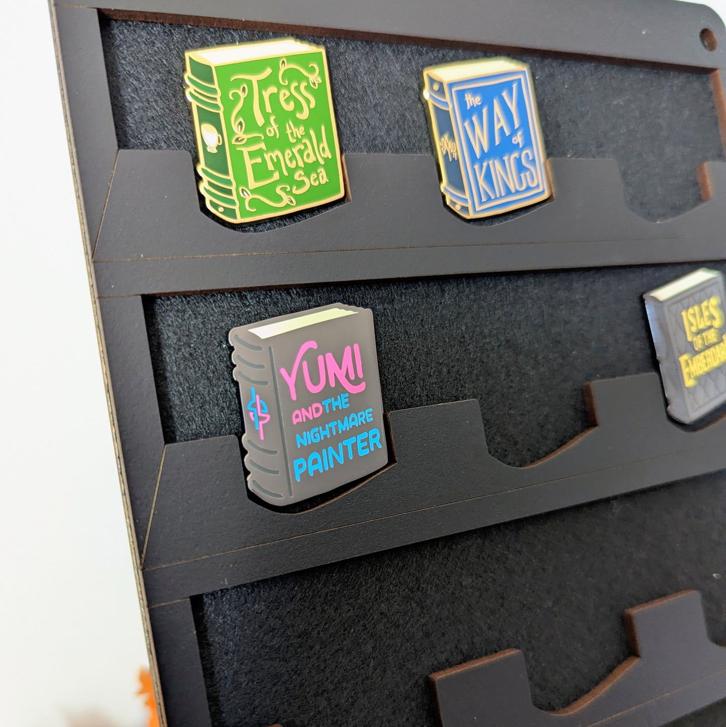 pin display for brandon sanderson sandershelf books stuff collectible pins stormlight archive cosmere cytoverse