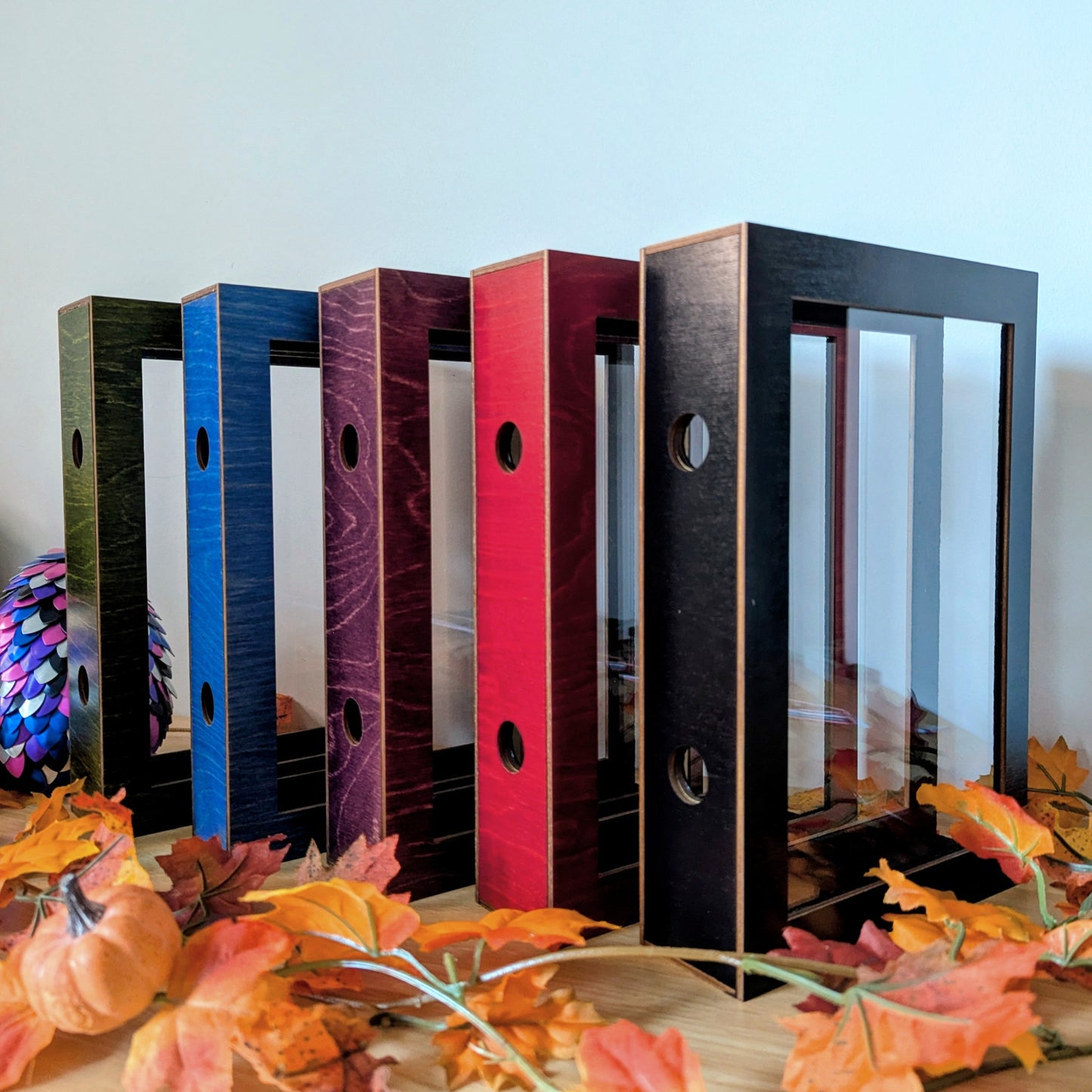 display cases for brandon sanderson's secret project novels, tress, frugal wizard, yumi, and sunlit man