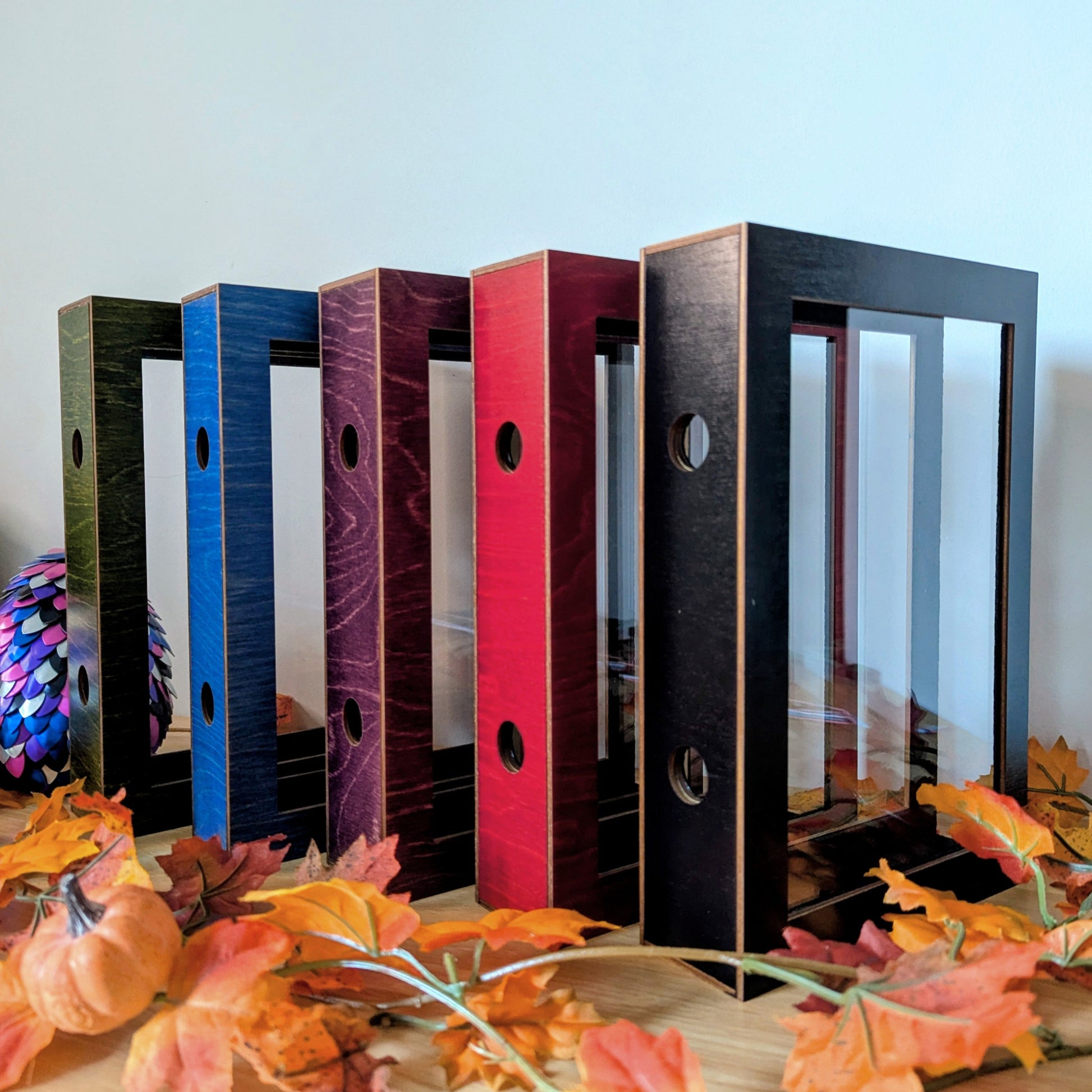 display cases for brandon sanderson's secret project novels, tress, frugal wizard, yumi, and sunlit man