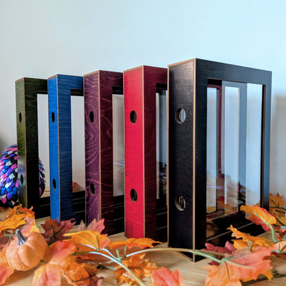display cases for brandon sanderson's secret project novels, tress, frugal wizard, yumi, and sunlit man