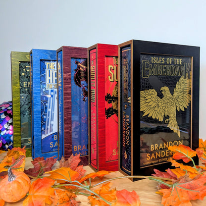 display cases for brandon sanderson's secret project novels, tress, frugal wizard, yumi, and sunlit man