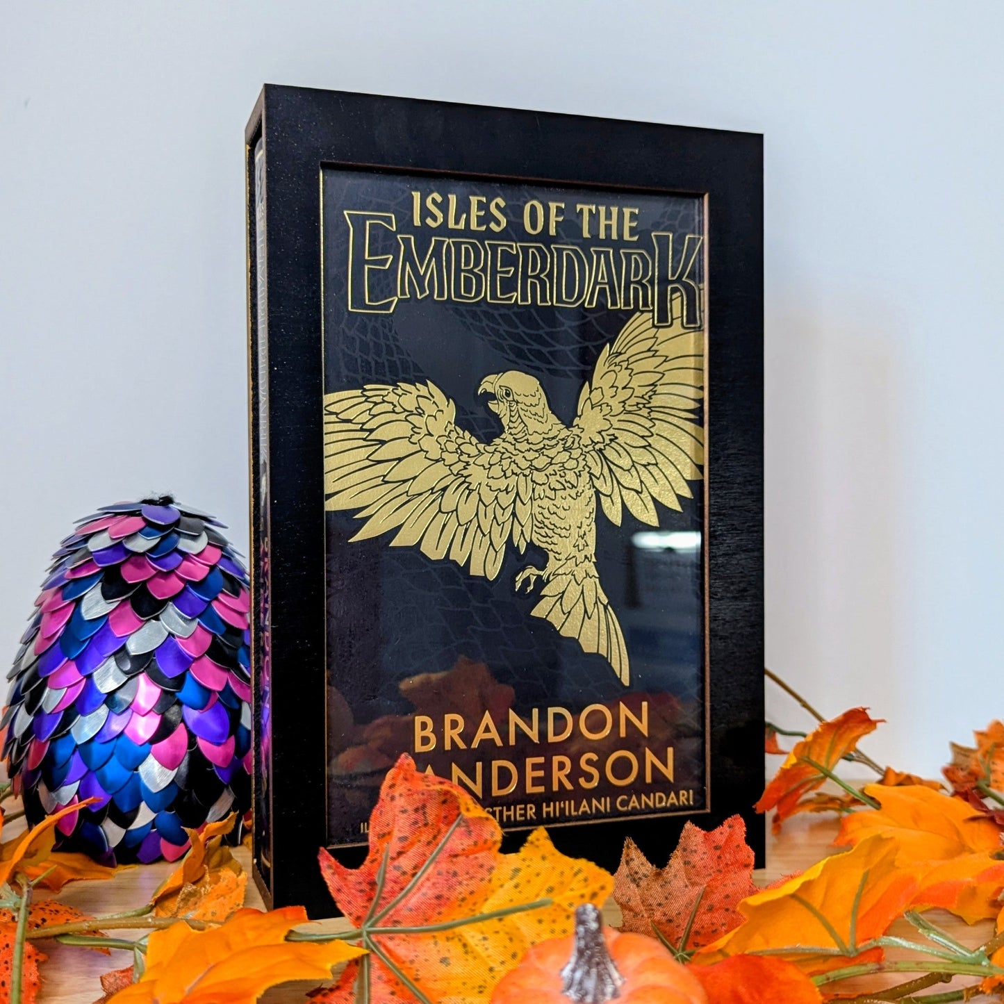 display cases for brandon sanderson's secret project novels, tress, frugal wizard, yumi, and sunlit man