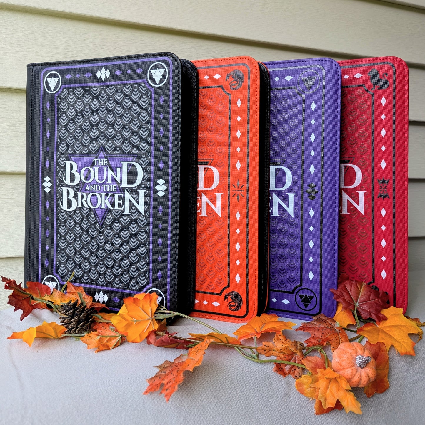 interior photo of the bound and the broken by Ryan Cahill collectible trading Patreon cards binder by dragon woodshop the order lorian empire Valtara wyvern