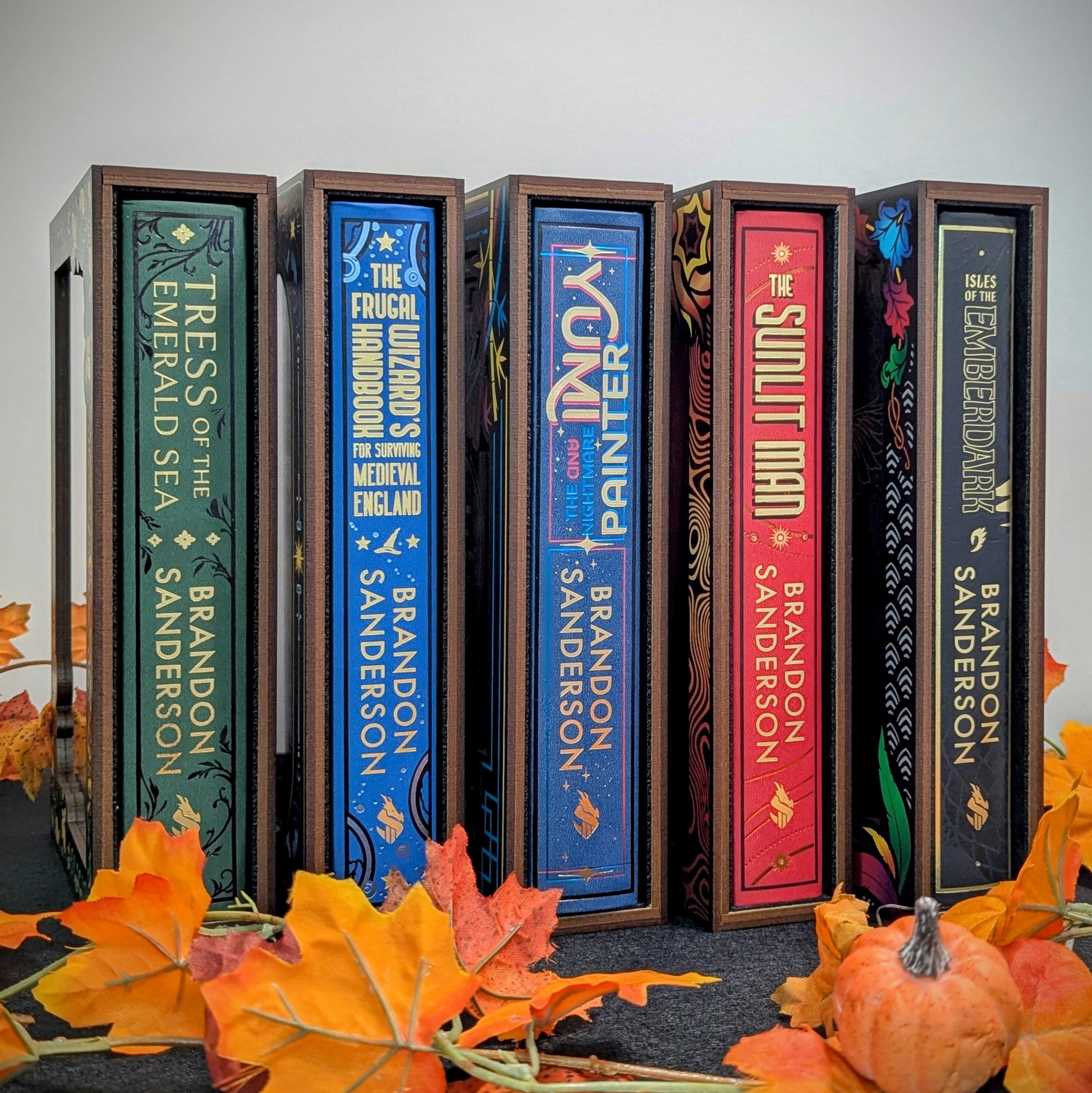 book display cases for brandon sanderson secret project books Tress Frugal Yumi Sunlit Man Emberdark