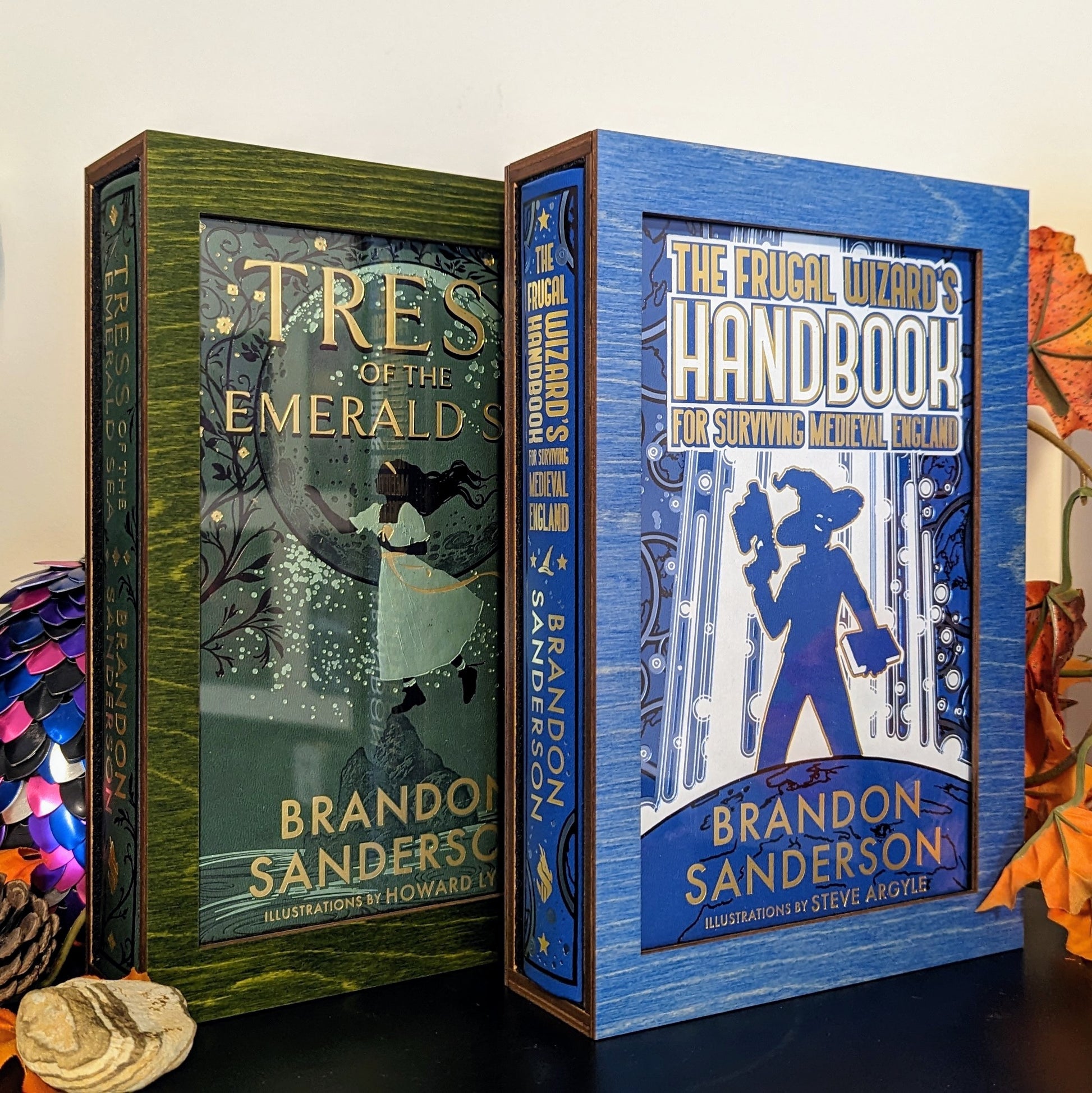 display cases for brandon sanderson's secret project novels tress, frugal wizard, yumi, and sunlit man