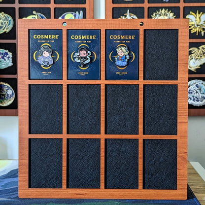 pin display for up to 2 inch enamel pins, handmade wooden pin frame, featuring year of sanderson cosmere character pins