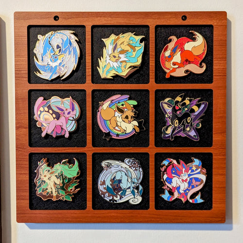 simple reversible pin display for up to 3 inch enamel pins, handmade wooden pin frame, featuring eeveelution pins